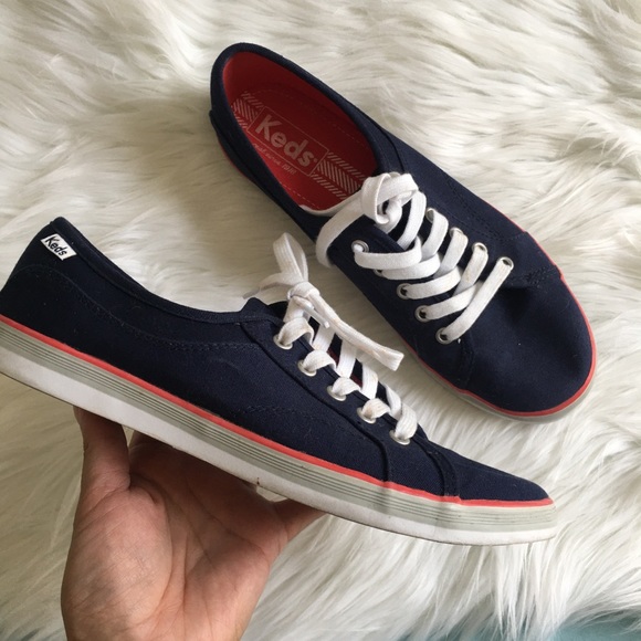 navy blue and white keds